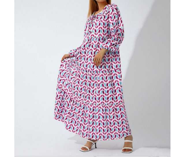 A woman in a summer bohemian v-neck dress stands by green doors, showcasing a flowy silhouette and boho-inspired design.